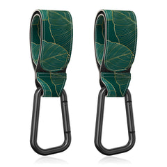 Gukeniu stroller hook close-up showing the green-leaf strap for hands-free bag handling.