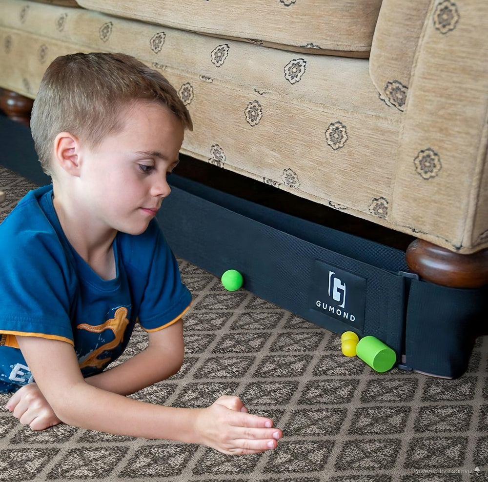 Gumond one-size blocker under sofa left view prevents pets and toys from slipping underneath.