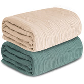 GUNTAIL muslin swaddle two-pack in beige and green for gentle daily swaddling.