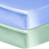 GUNTAIL satin crib sheet blue on mattress offers snug fit and smooth surface for baby comfort