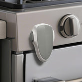 GXXFXT child-proof oven lock back view shows strong adhesive for kitchen safety.