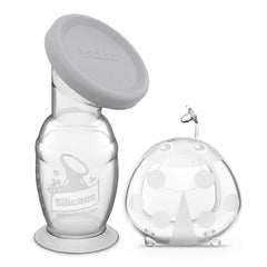 Haakaa 100ml manual breast pump with suction base catching let-down while nursing