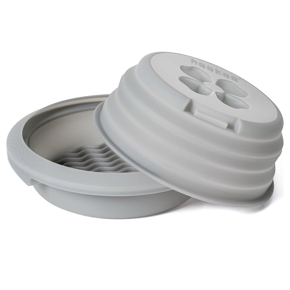 Haakaa microwave sterilizer lid shown for secure steam sterilisation