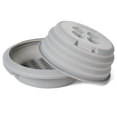 Haakaa microwave sterilizer lid shown for secure steam sterilisation