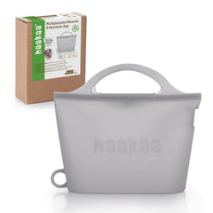 Haakaa On-The-Go steam bag in use with baby bottle for quick sterilization on the go
