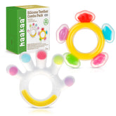 Haakaa teether palm close-up; soft silicone soothes gums during teething.