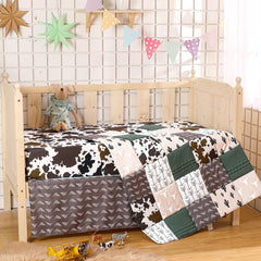 Hahafelt neutral cow cactus print quilt on display adds calming barnyard style