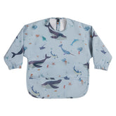 HALAA VAUVA long sleeve bib folded in a diaper bag for travel protection.