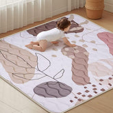 Haleeone baby play mat 50x50 folded provides a portable play surface for travel and storage.