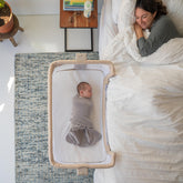 HALO BassiNest side-panel breathable mesh promotes airflow for close, comfortable sleep.