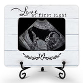 Hangwoous sonogram frame with wooden stand showcases ultrasound memories.