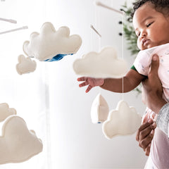 Happiest Baby Sky Mobile ceiling-hanging option becomes nursery decor after SNOO use.