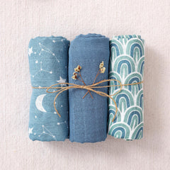 Happy Flute muslin swaddle blankets soft fabric closeup, emphasizing breathable texture ideal for delicate newborn skin.