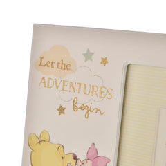 Happy Homewares Winnie Pooh photo frame with gold lettering enhances nursery decor.