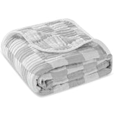 HardNok Ultra-Soft Muslin blanket in grey checkered folded for nursery storage.