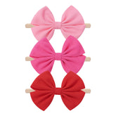 Hellykaka valentines bows set shows red-pink headbands for daily outfits.