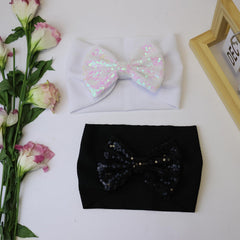 HELykAKA white sequin bow headband closeup highlights soft materials for newborn wear.