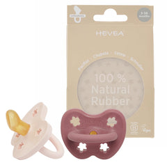 HEVEA pacifier orthodontic powder pink demonstrates natural rubber soothing.