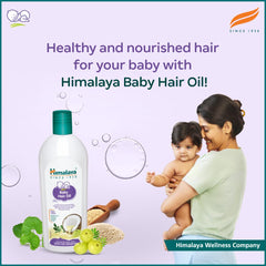Himalaya Baby Hair Oil dropper releasing soothing scalp nourishment.