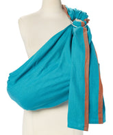 Hip Baby Wrap turquoise ring sling worn for full baby wearing with comfortable support.