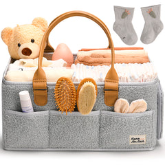 HOME FOR EACH diaper caddy with handle keeps nursery essentials within reach.