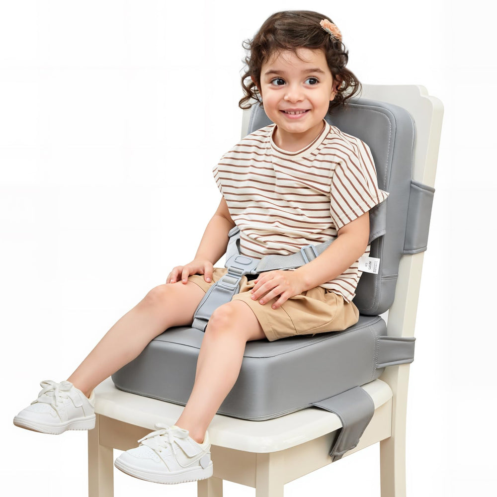 HOMEAL booster seat on a kitchen chair shows secure straps for safe toddler meals.