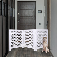 Homebia Designs wooden pet gate folded for compact storage after use.