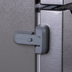 HomeBrella fridge lock with adhesive being installed on a fridge door.