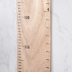 HOMEE growth chart patchwork design displayed as customizable wall decor.