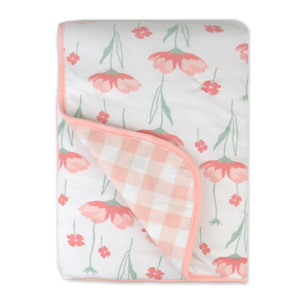 HonestBaby reversible blanket print side offers cozy tummy time comfort.