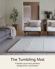 House of Noa foldable baby tumbling mat open in checker almond, creating a spacious cushioned play area.