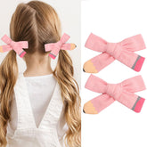 HOXIEYA pencil-bow hairclip pink secure hold for school days.