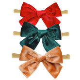 Hoyuwak 3pc velvet baby bows front view for festive newborn styling.