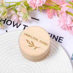 Hpmjz Engraved umbilical cord box with leaf carvings adds warm nursery decor.