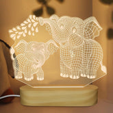 HPYDIY elephant 3D crystal light with wood stand glows softly for a calm night display.
