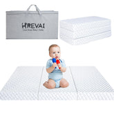 HREVAI Pack and Play Mattress folded for travel, compact and easily portable.