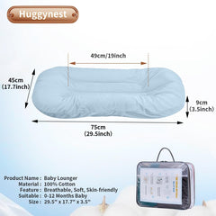 Huggynest blue lounger side view highlights portable infant nest for travel and room-to-room use