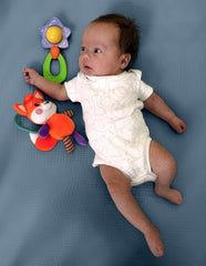 Hugs & Llamas organic muslin crib sheet snug-fit detail on mattress edge.