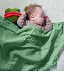 Hugs & Llamas swaddle in-use image demonstrates cozy, secure wrap for newborns.