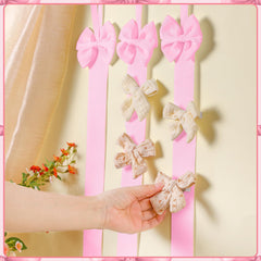 Huquary satin ribbon organizer adds elegant storage to nursery or wall decor