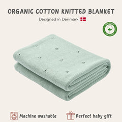 Huxie baby blanket in stroller usage highlighting lightweight warmth for outings.