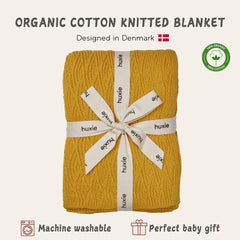 Huxie baby blanket in stroller used for on‑the‑go comfort