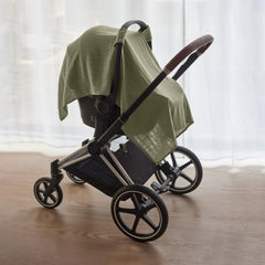 Huxie car seat cover on stroller demonstrates easy fit