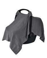 Huxie car seat cover in soft grey organic muslin for gentle baby comfort.