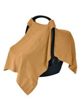 Huxie Denmark muslin carseat cover in autumn yellow shields baby from sun, wind, and dust.