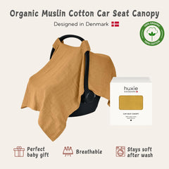 Huxie Denmark car seat canopy offers privacy while on the go in soft organic muslin.