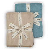 Huxie knitted baby blanket in fog color shows ultra-soft organic cotton for newborn comfort.