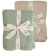 Huxie knitted baby blanket Fog colorway offers cozy organic warmth for sensitive skin.