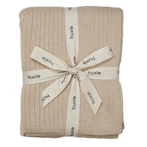 Huxie knitted baby blanket fog ribbed closeup shows ultra-soft texture for sensitive skin.