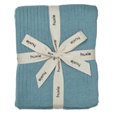 Huxie polar blue knitted baby blanket folded for cozy crib time